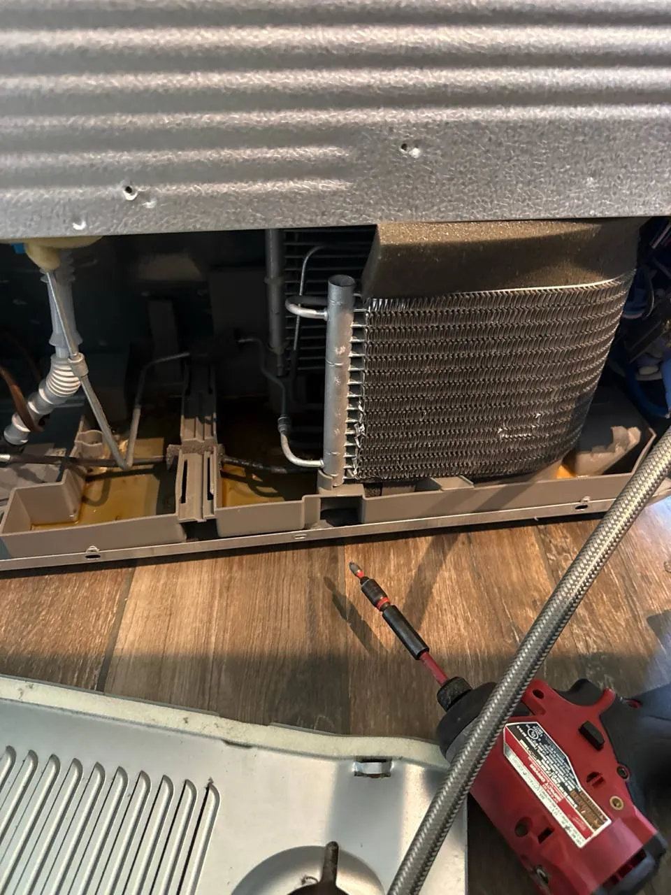 Refrigerator repair in progress